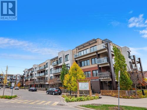 413 - 5005 Harvard Road E, Mississauga, ON - Outdoor With Balcony With Facade