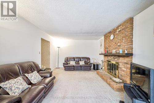 1076 Huntingwood Drive, Toronto, ON - Indoor Photo Showing Living Room With Fireplace