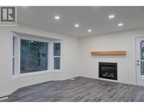 9685 Mossman Road, Prince George, BC - Indoor Photo Showing Living Room With Fireplace