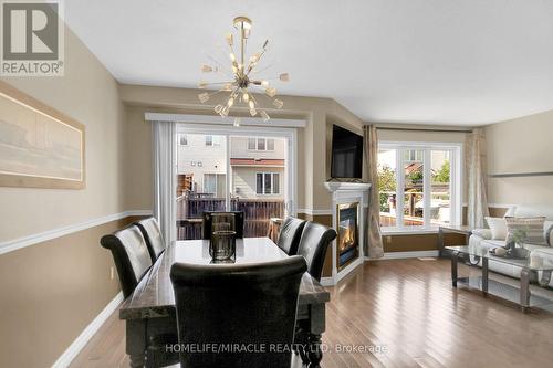 462 Citadel Crescent E, Barrhaven, ON - Indoor Photo Showing Dining Room With Fireplace