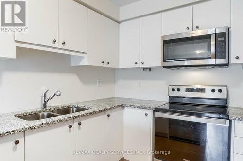 1 - 26 Humberwood Boulevard, Toronto, ON - Indoor Photo Showing Kitchen With Double Sink