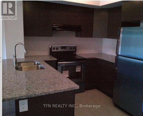 302 - 70 Baycliffe Crescent W, Brampton, ON - Indoor Photo Showing Kitchen With Double Sink