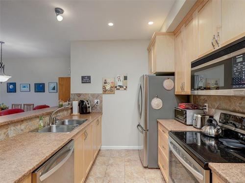 102-10421 Resthaven Dr, Sidney, BC - Indoor Photo Showing Kitchen With Double Sink