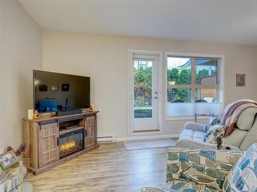 102-10421 Resthaven Dr, Sidney, BC - Indoor Photo Showing Living Room With Fireplace