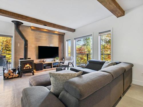 Living room - 61 Rue Du Hameau, Saint-Côme, QC - Indoor Photo Showing Living Room With Fireplace