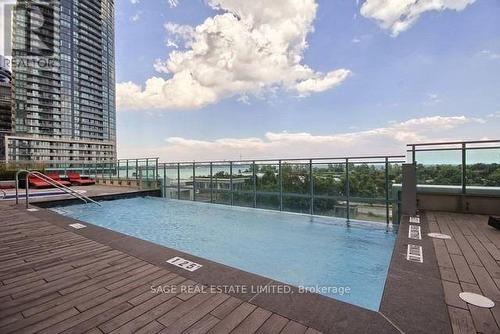 1203 - 33 Shore Breeze Drive, Toronto, ON - Outdoor With In Ground Pool With Deck Patio Veranda