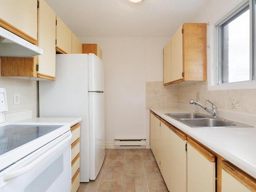 Cuisine - 402-1570 Rue Robert-Charbonneau, Montréal (Ahuntsic-Cartierville), QC - Indoor Photo Showing Kitchen With Double Sink