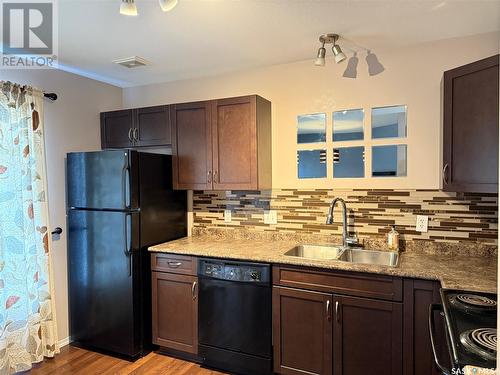 127 700 2Nd Avenue S, Martensville, SK - Indoor Photo Showing Kitchen With Double Sink