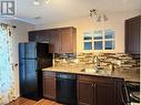 127 700 2Nd Avenue S, Martensville, SK  - Indoor Photo Showing Kitchen With Double Sink 