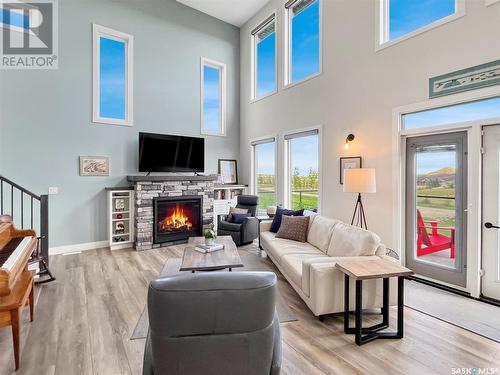 28 Sunrise Drive N, Blackstrap Skyview, SK - Indoor Photo Showing Living Room With Fireplace