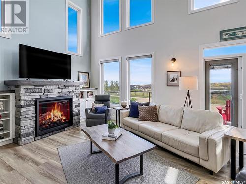 28 Sunrise Drive N, Blackstrap Skyview, SK - Indoor Photo Showing Living Room With Fireplace