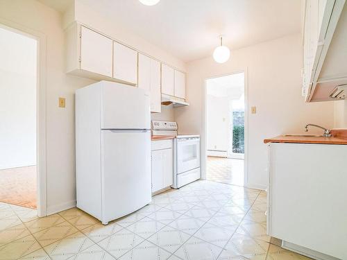 Cuisine - 39-1800 Place Dunant, Saint-Bruno-De-Montarville, QC - Indoor Photo Showing Kitchen