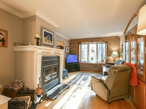 Living room - 102 Rue Des Primeroses, Saint-Colomban, QC - Indoor Photo Showing Living Room With Fireplace