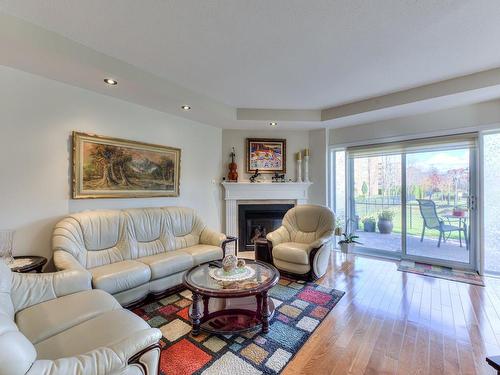 Salon - R-04-4625 Av. Félix-Leclerc, Montréal (Saint-Laurent), QC - Indoor Photo Showing Living Room With Fireplace