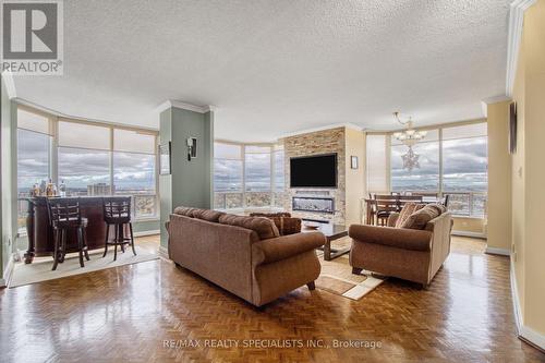 2410 - 22 Hanover Road, Brampton, ON - Indoor Photo Showing Living Room With Fireplace