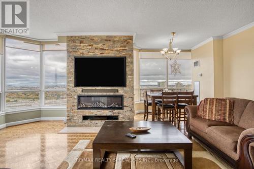 2410 - 22 Hanover Road, Brampton, ON - Indoor Photo Showing Living Room With Fireplace