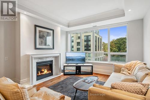 409 - 155 St Clair Avenue W, Toronto, ON - Indoor Photo Showing Living Room With Fireplace