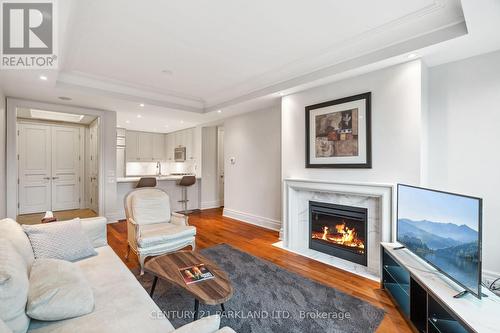 409 - 155 St Clair Avenue W, Toronto, ON - Indoor Photo Showing Living Room With Fireplace