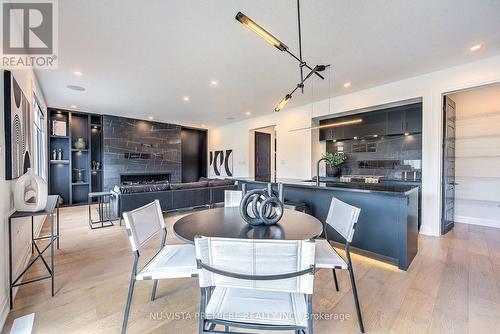 Pictures are from previously finished Model Home. - 2622 Heardcreek Trail, London, ON - Indoor Photo Showing Dining Room With Fireplace