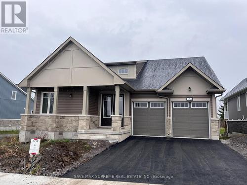 154 Country Club Drive, Loyalist, ON - Outdoor With Facade