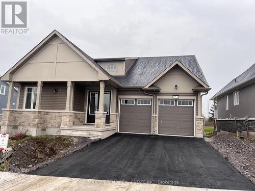 154 Country Club Drive, Loyalist, ON - Outdoor With Facade