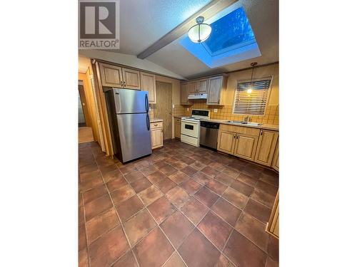 32 - 7126 3A Highway, Nelson, BC - Indoor Photo Showing Kitchen With Double Sink