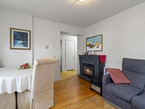 Vue d'ensemble - 218 Boul. Des Prairies, Laval (Laval-Des-Rapides), QC - Indoor Photo Showing Living Room With Fireplace