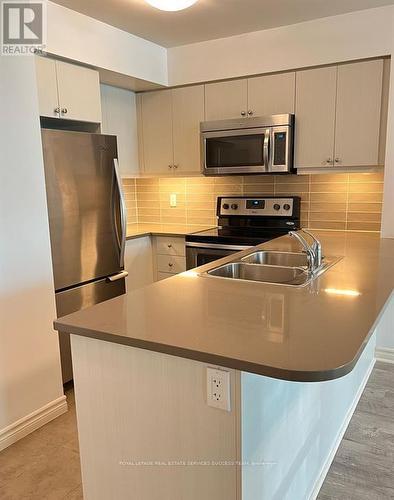 722 - 25 Lower Simcoe Street, Toronto, ON - Indoor Photo Showing Kitchen With Double Sink