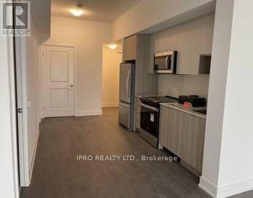 1707 - 202 Burnhamthorpe Road E, Mississauga, ON - Indoor Photo Showing Kitchen With Stainless Steel Kitchen