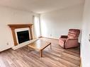 920 Lakewood N Nw, Edmonton, AB  - Indoor Photo Showing Living Room With Fireplace 