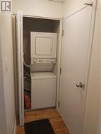 Laundry unit at the end of the hallway. - 