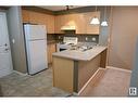 #211 616 Mcallister Lo Sw, Edmonton, AB  - Indoor Photo Showing Kitchen With Double Sink 