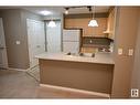 #211 616 Mcallister Lo Sw, Edmonton, AB  - Indoor Photo Showing Kitchen With Double Sink 