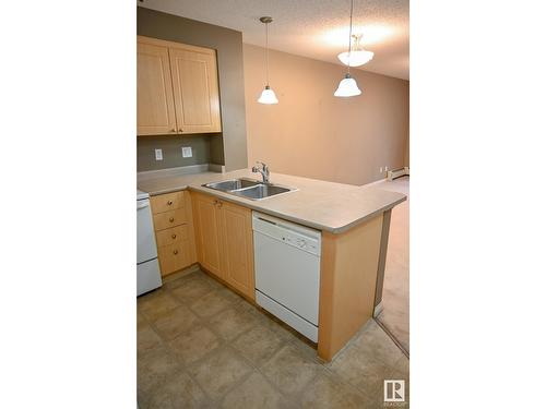 #211 616 Mcallister Lo Sw, Edmonton, AB - Indoor Photo Showing Kitchen With Double Sink