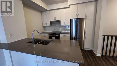 Th 355 - 100 Honeycrisp Crescent, Vaughan, ON - Indoor Photo Showing Kitchen With Stainless Steel Kitchen With Double Sink With Upgraded Kitchen