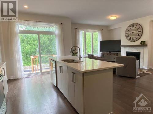 655 Persimmon Way, Ottawa, ON - Indoor Photo Showing Kitchen With Fireplace With Double Sink