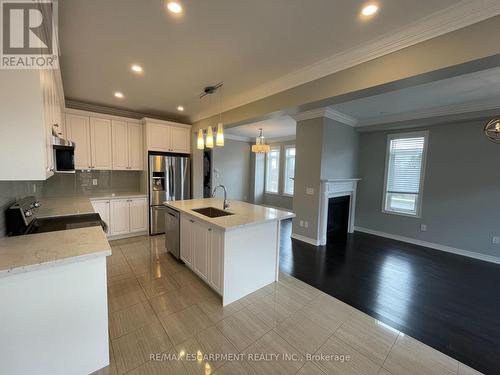 563 Stream Crescent, Oakville, ON - Indoor Photo Showing Kitchen With Fireplace With Stainless Steel Kitchen