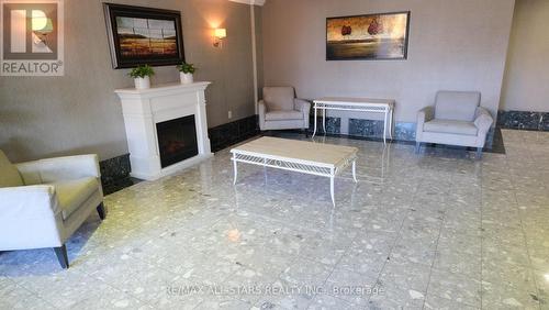 332 - 3 Greystone Walk Drive, Toronto, ON - Indoor Photo Showing Living Room With Fireplace