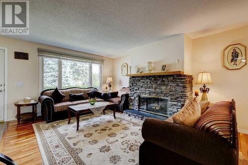 940 Rundlecairn Way Ne, Calgary, AB - Indoor Photo Showing Living Room With Fireplace