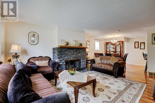 940 Rundlecairn Way Ne, Calgary, AB - Indoor Photo Showing Living Room With Fireplace