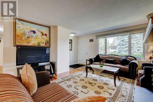 940 Rundlecairn Way Ne, Calgary, AB - Indoor Photo Showing Living Room With Fireplace