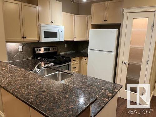 #144 10121 80 Av Nw, Edmonton, AB - Indoor Photo Showing Kitchen With Double Sink