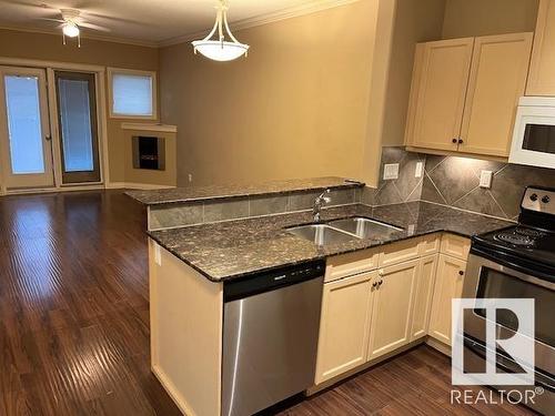 #144 10121 80 Av Nw, Edmonton, AB - Indoor Photo Showing Kitchen With Double Sink