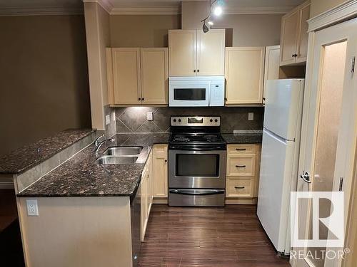 #144 10121 80 Av Nw, Edmonton, AB - Indoor Photo Showing Kitchen With Double Sink