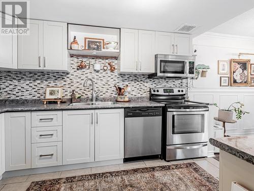 1115 - 20 Dean Park Road, Toronto, ON - Indoor Photo Showing Kitchen With Stainless Steel Kitchen With Double Sink With Upgraded Kitchen