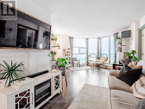 1115 - 20 Dean Park Road, Toronto, ON - Indoor Photo Showing Living Room With Fireplace