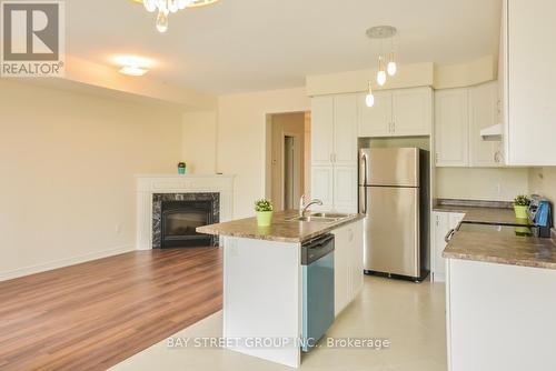 479 Terrace Way, Oakville, ON - Indoor Photo Showing Kitchen With Fireplace With Stainless Steel Kitchen