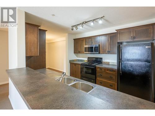 4874 Stanley Street Unit# 106, Radium Hot Springs, BC - Indoor Photo Showing Kitchen With Double Sink