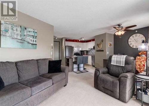 410, 6000 Somervale Court Sw, Calgary, AB - Indoor Photo Showing Living Room