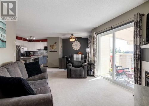 410, 6000 Somervale Court Sw, Calgary, AB - Indoor Photo Showing Living Room